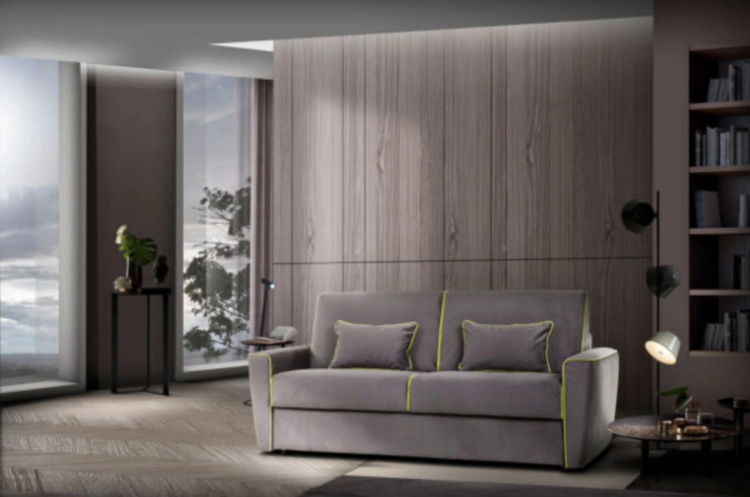 Divano grigio con profili verdi in un soggiorno con finiture in legno