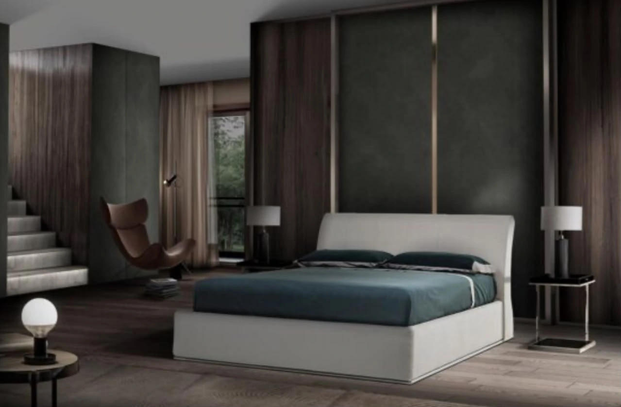 Letto imbottito in una camera con armadio a tutta parete